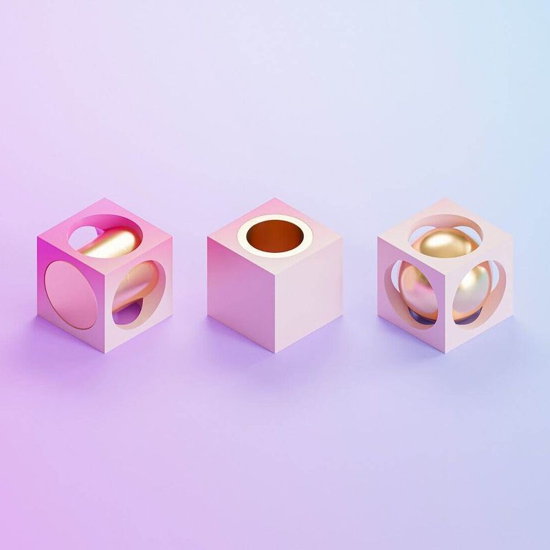 Three abstract shapes on a soft gradient background