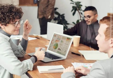 A group of people meeting in an office.