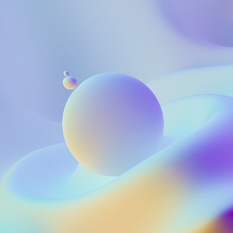 Three abstract shapes on a soft gradient background