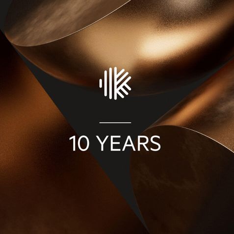 Gold Karbon brand elements with the Karbon logo and text that reads, "10 years."