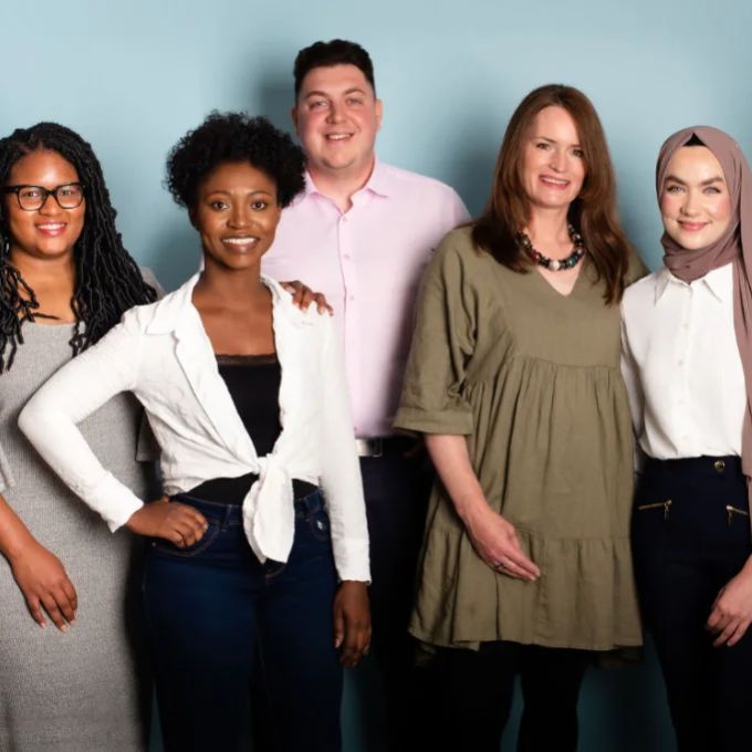 6 members of the BKL ABS team standing in front of a gray/blue wall.